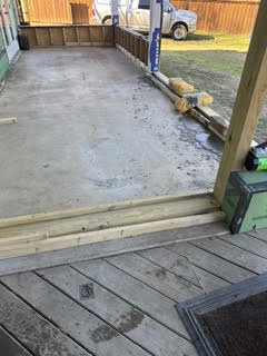 Deck under construction with new wood decking